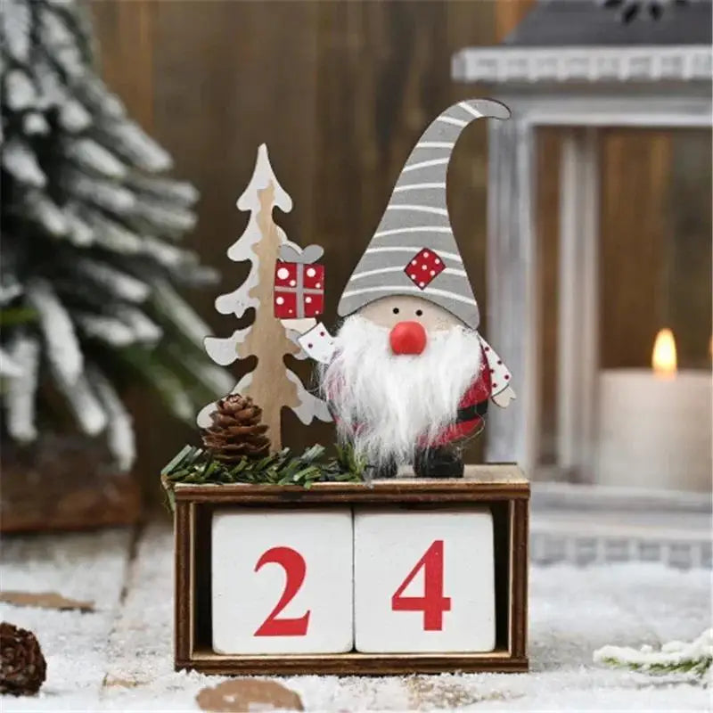 Christmas gnome with wooden blocks displaying '24', surrounded by festive decorations.