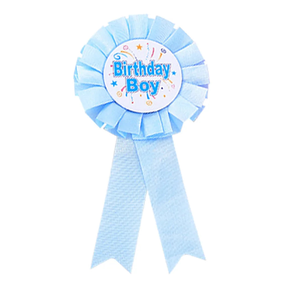 Blue ribbon with 'Birthday Boy' text on a white background