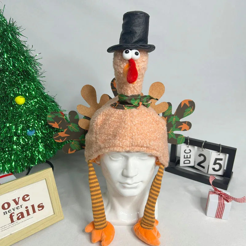 Turkey-themed knitted hat with top hat and orange feet on a mannequin head, Christmas decorations in the background.