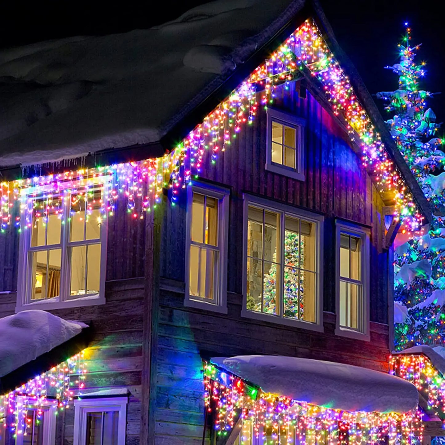 Wooden cabin decorated with colorful Christmas lights against a dark sky.