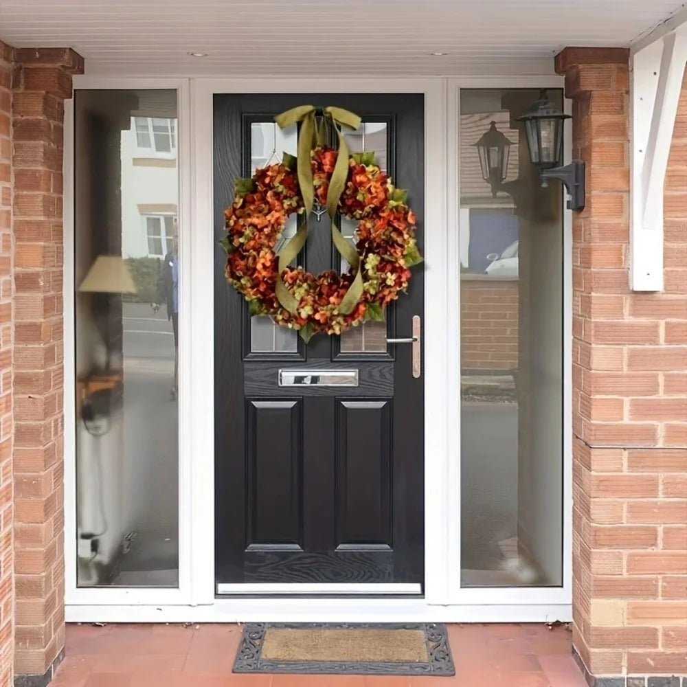 Black front door with a decorative wreath on a brick house exterior