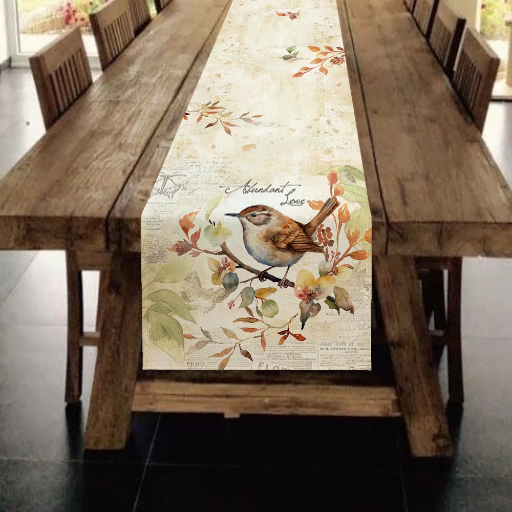Table runner with bird and floral design on a wooden table