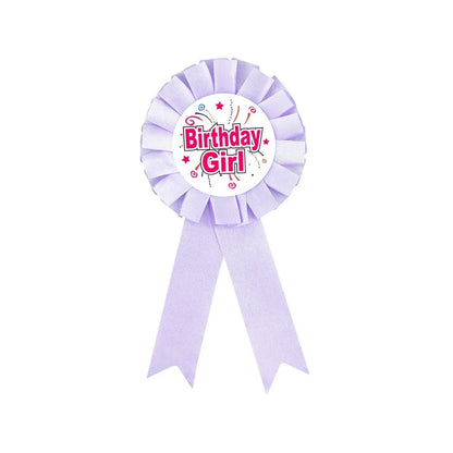 Purple 'Birthday Girl' ribbon award on a white background