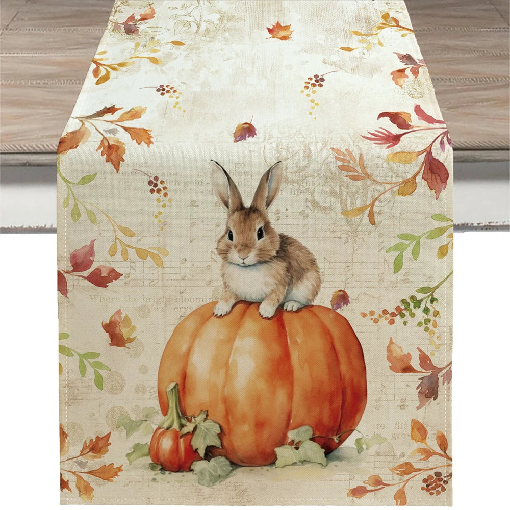 Table runner with a rabbit on a pumpkin and autumn leaf design