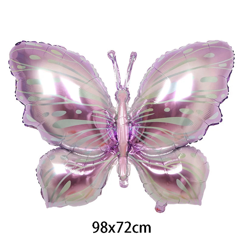 Butterfly-shaped balloon with pink and purple colors on a white background