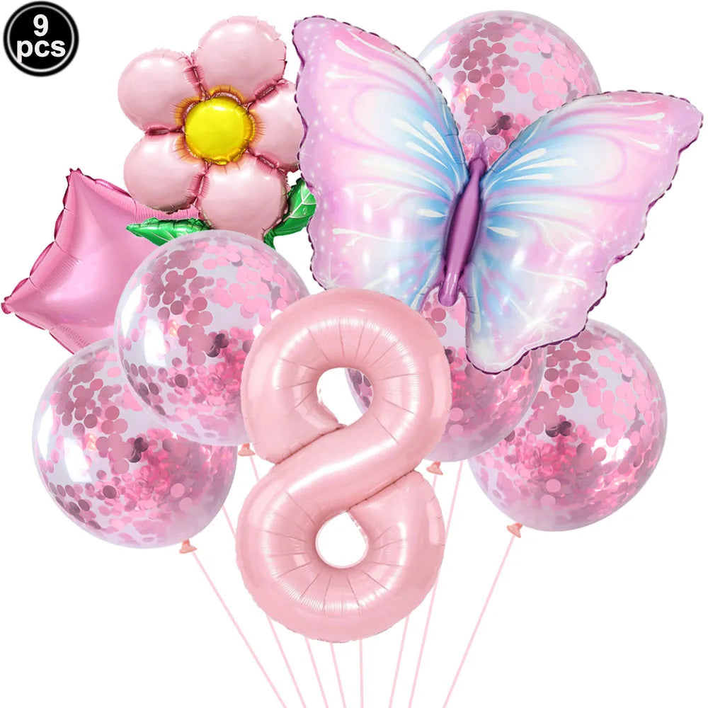 Set of pink balloons including a butterfly, number 8, and flower design on a white background.