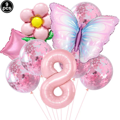 Set of pink balloons including a butterfly, number 8, and flower design on a white background.