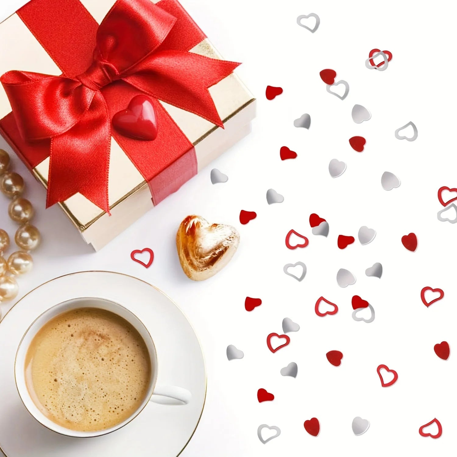 Gift box with red ribbon, coffee cup, pastry, and heart-shaped confetti on a white background