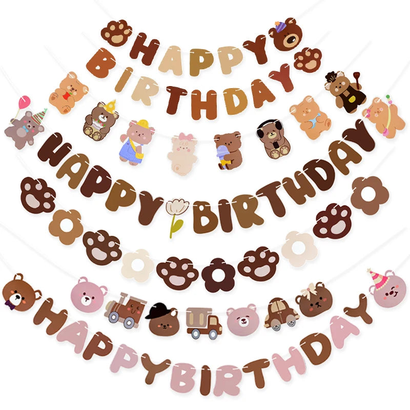 Cartoon bear-themed 'Happy Birthday' banner with paw prints and flowers on a white background