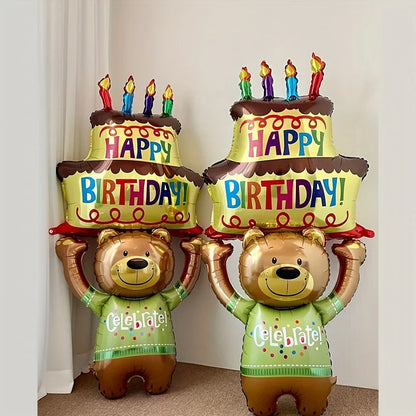 Two bear-shaped birthday balloons with cake toppers and candles on a plain background