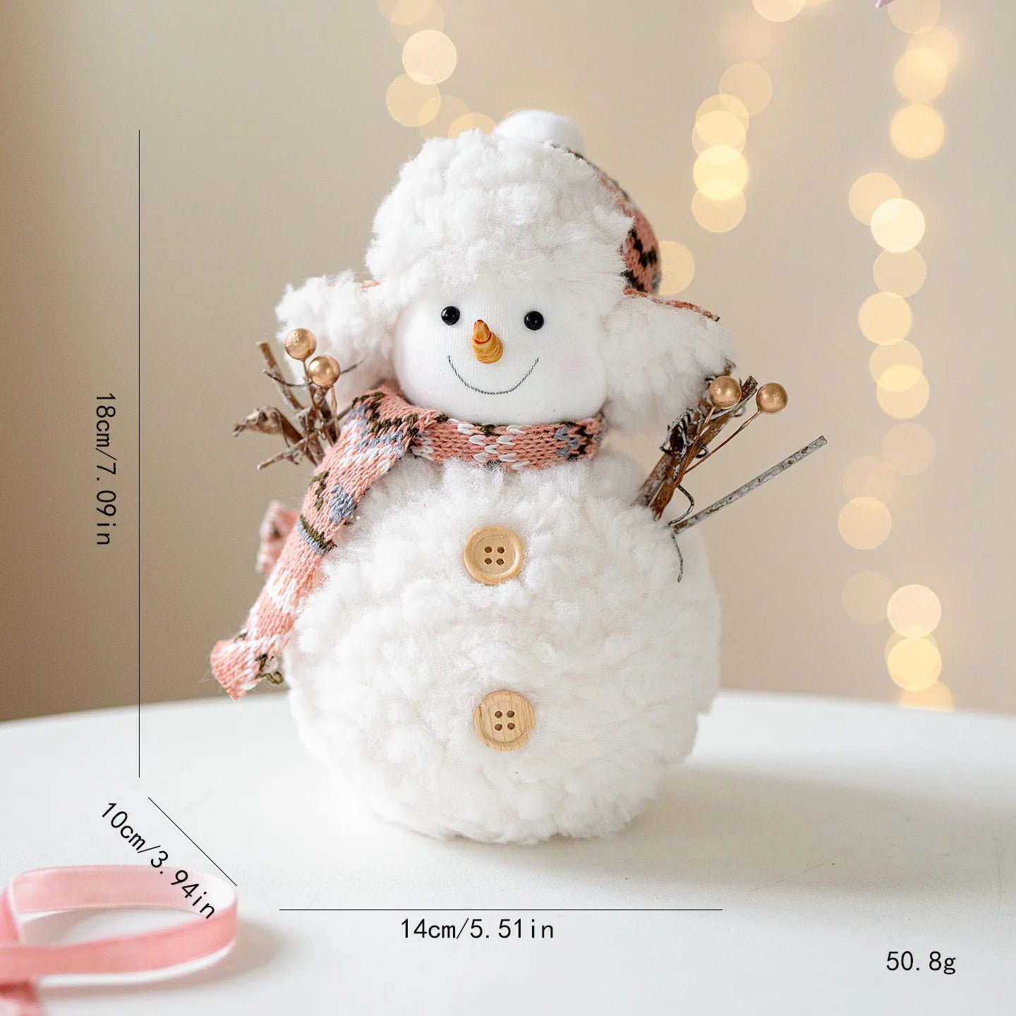 Decorative snowman figure with measurements on a neutral background