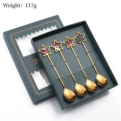 Set of gold star-shaped spoons in a green box with weight information.