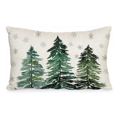 Decorative pillow with green trees and snowflakes on a white background