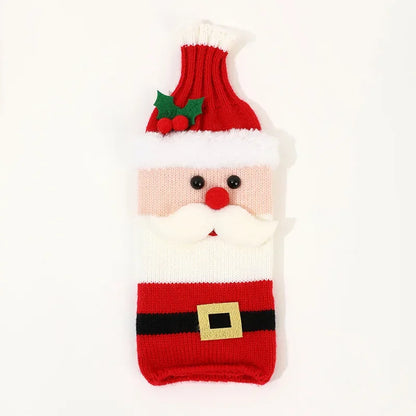 Knitted Santa Claus wine bottle cover on a white background