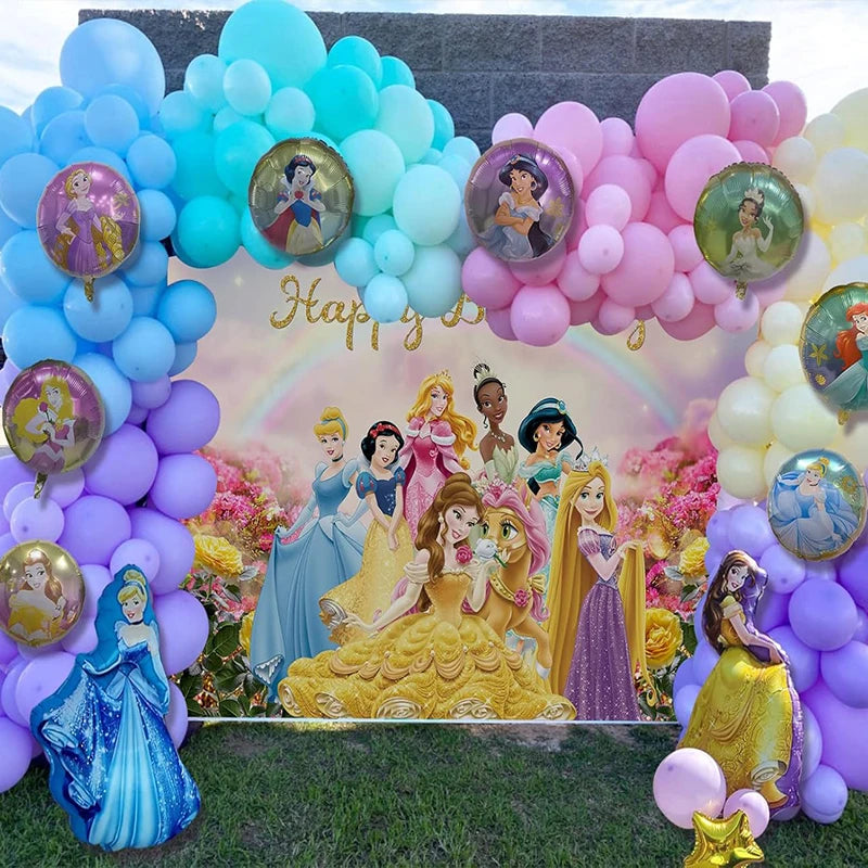 Decorative arch with balloons and Disney princesses in front