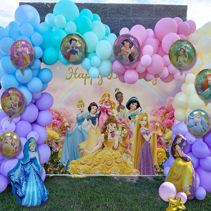 Decorative arch with balloons and Disney princesses in front