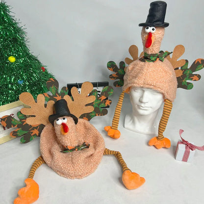 Two festive hats resembling a turkey and a reindeer with decorative elements on a neutral background.