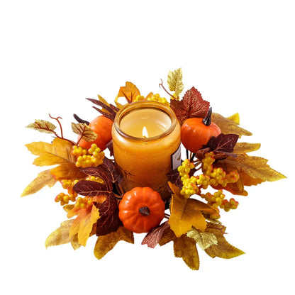 Decorative candle holder with autumn leaves and pumpkins on a white background