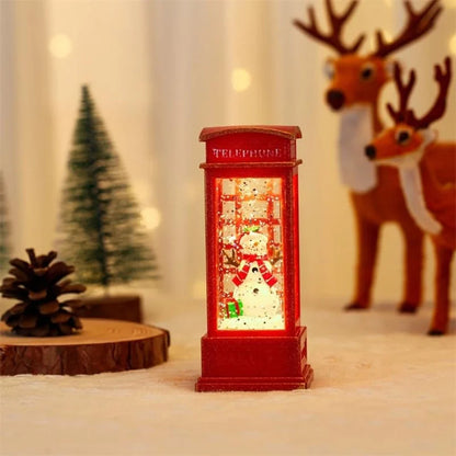 Decorative red telephone booth with snowman inside, surrounded by festive elements like a reindeer and Christmas tree.