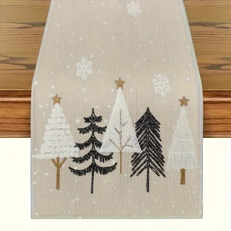Decorative table runner with embroidered trees and snowflakes on a wooden surface