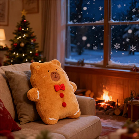 Cozy living room with a capybara pillow on a couch, Christmas tree, and fireplace.
