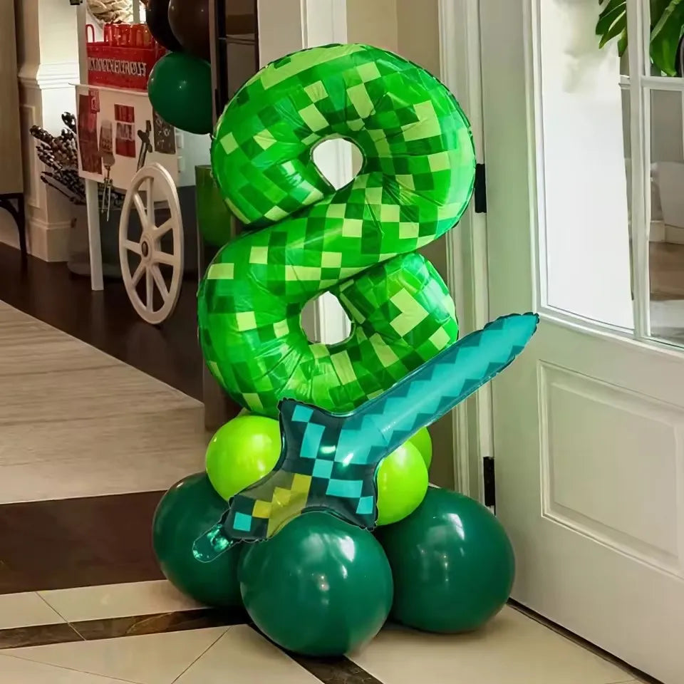 Minecraft creeper balloon in an 8 and diamond sword balloon on top of green balloons in a house setting.