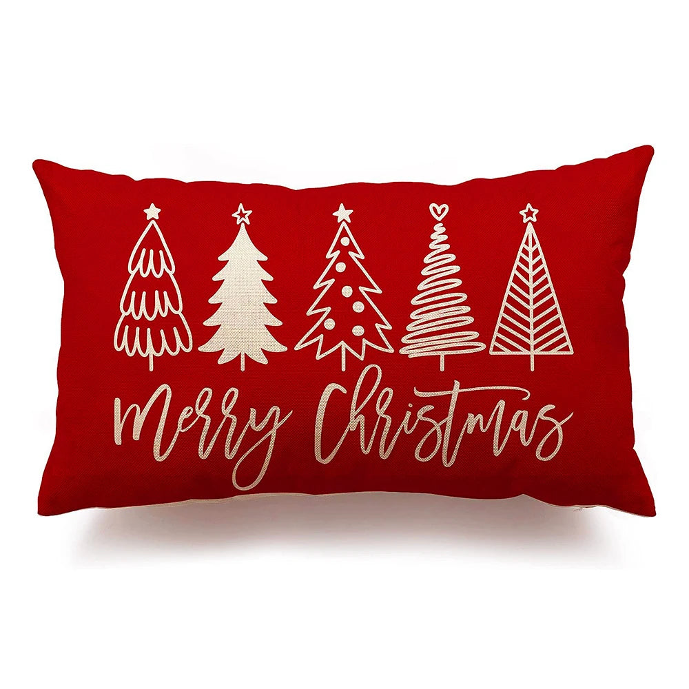Red pillow with white Christmas tree designs and 'Merry Christmas' text on a white background