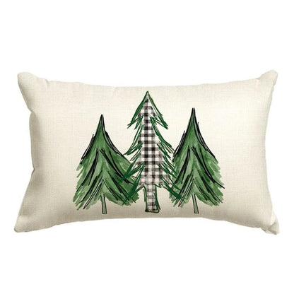 Decorative pillow with green trees and a plaid tree on a white background