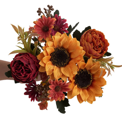 Bouquet of artificial flowers including sunflowers and roses on a white background