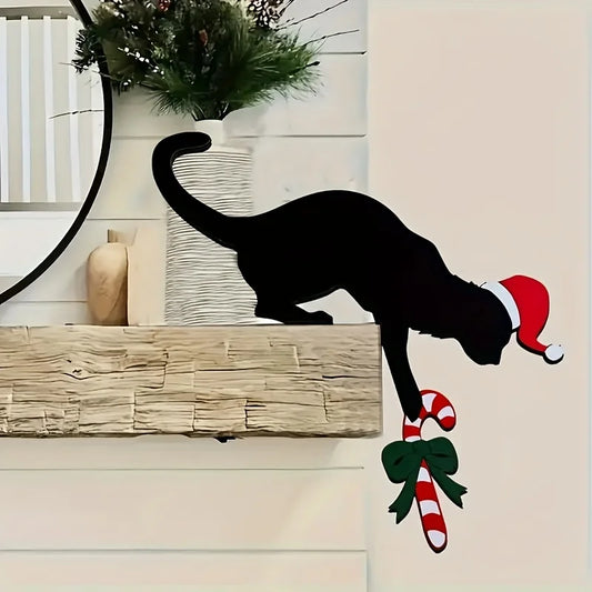 Black cat silhouette with Santa hat and candy cane on a decorative wall