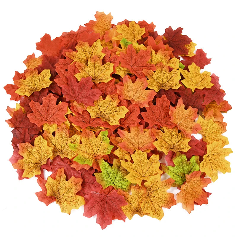Pile of colorful artificial leaves on a white background