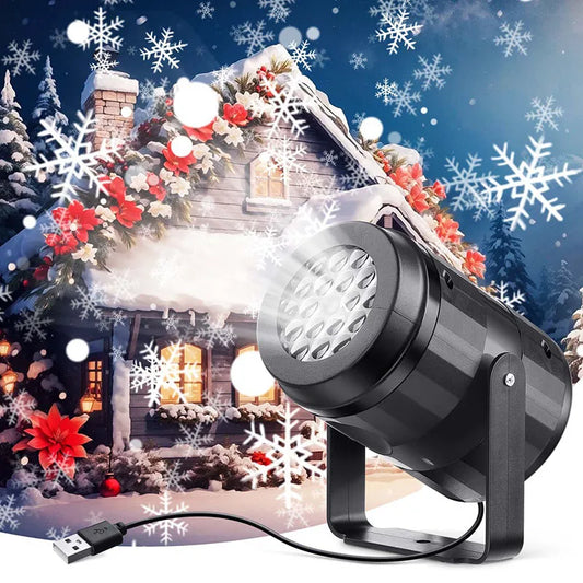Black outdoor light projector with USB cable in front of a decorated Christmas scene with a house and snowflakes.