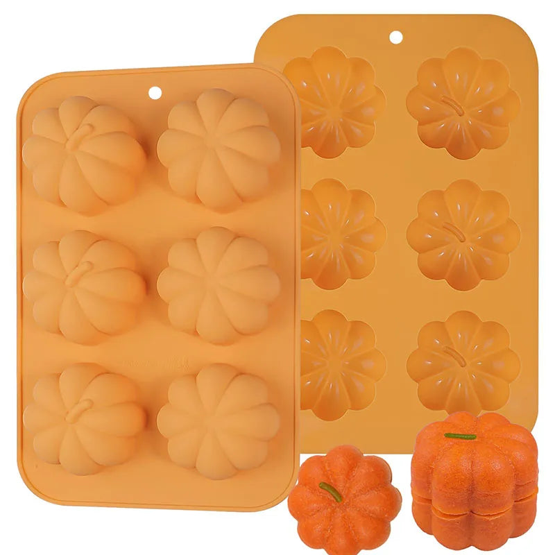 Silicone mold with pumpkin shapes and two small pumpkins on a white background