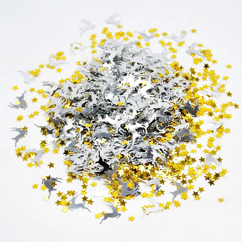 Confetti with silver reindeer and gold stars on a white background