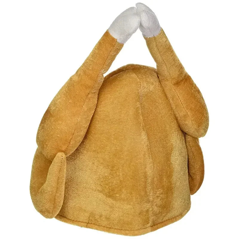 Plush hat resembling a roasted turkey on a white background