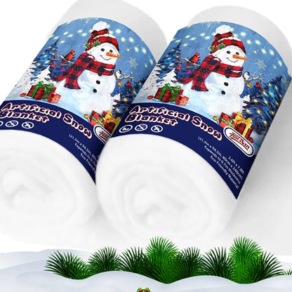 Two packages of artificial snow with a Christmas-themed design featuring a snowman and presents.