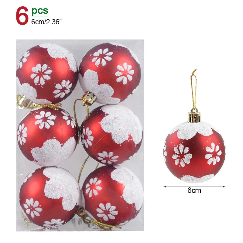 Red Christmas ornaments with white floral patterns in a clear package, showing size measurement.