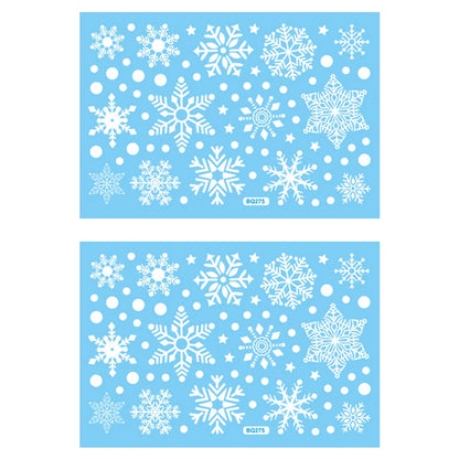 Two sheets of white snowflake stickers on a blue background