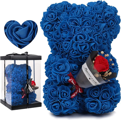 Blue rose teddy bear with a smaller rose bear in a box on a white background