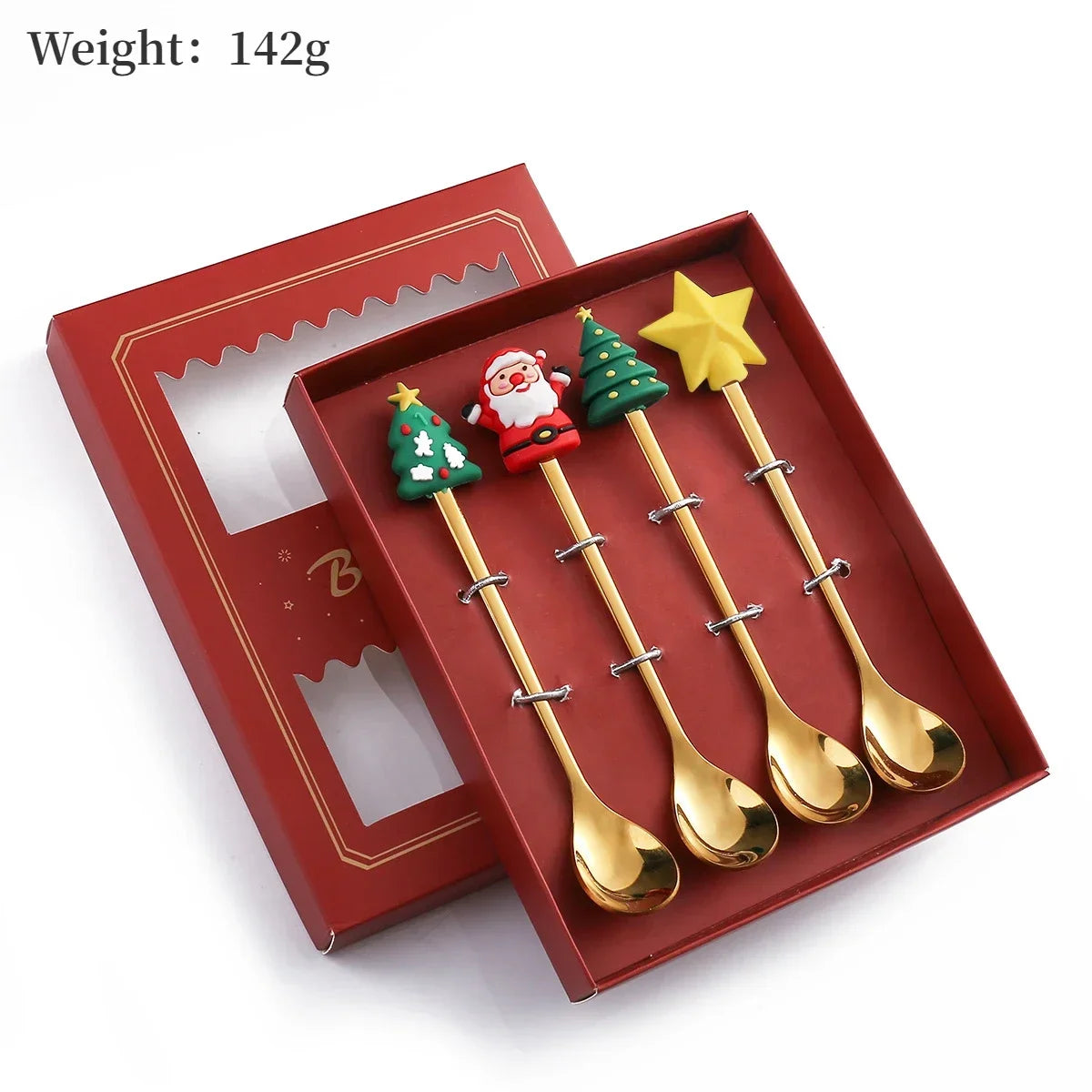 Set of four gold Christmas-themed spoons in a red box with a weight label.