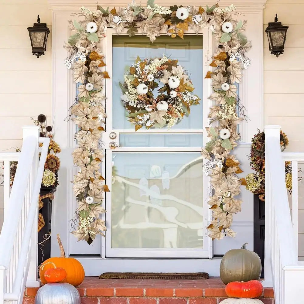 Decorative wreath with pumpkins on a front door