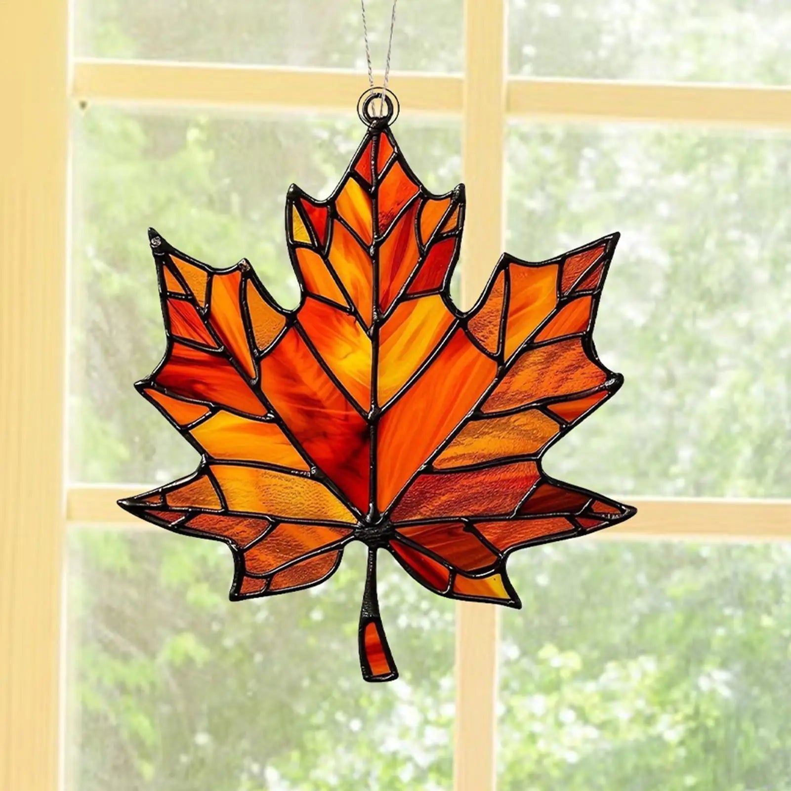 acrylic maple leaf hanging on a window