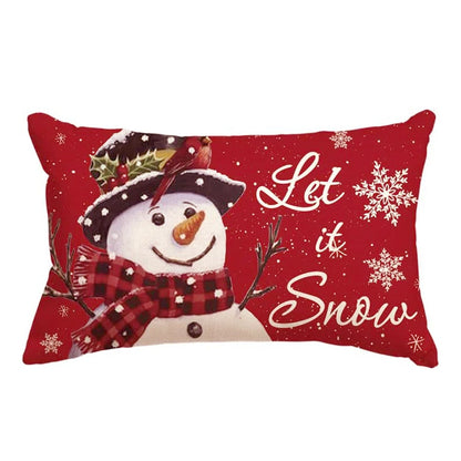 Red pillow with a snowman design and 'Let it Snow' text on a white background