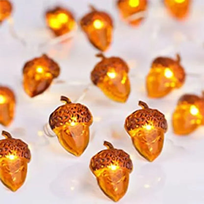 String lights shaped like acorns on a white background
