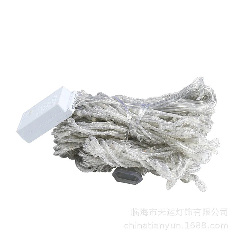 String lights with white connector on a white background