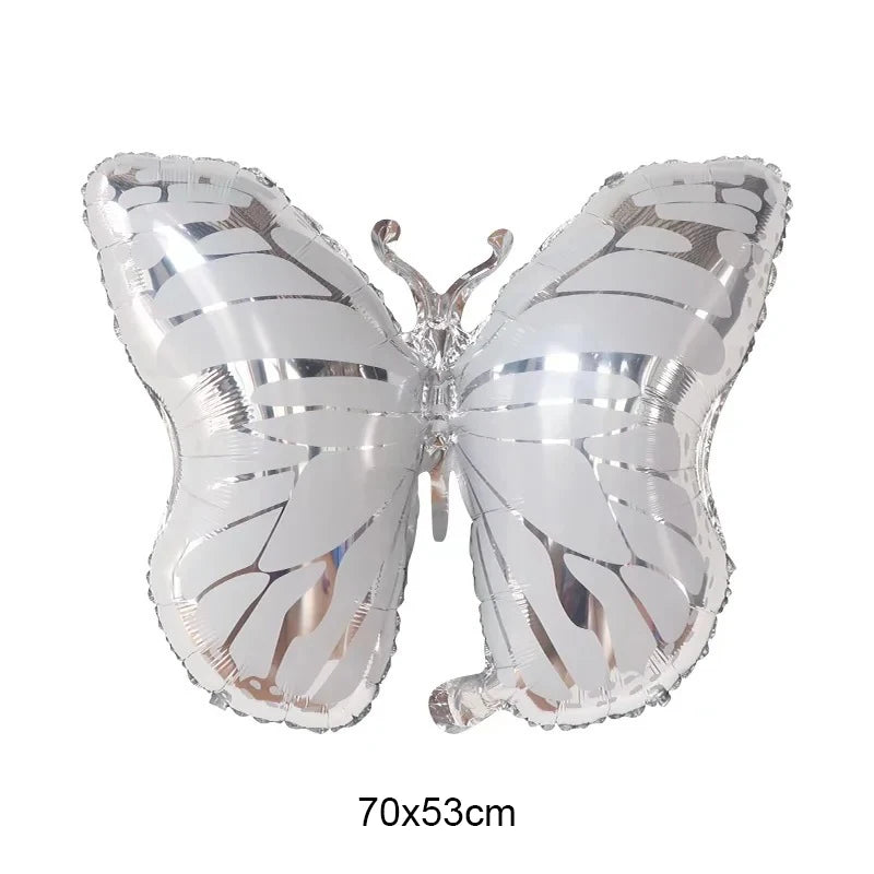Silver butterfly-shaped foil balloon on a white background