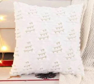 White textured pillow on a couch with a blurred background