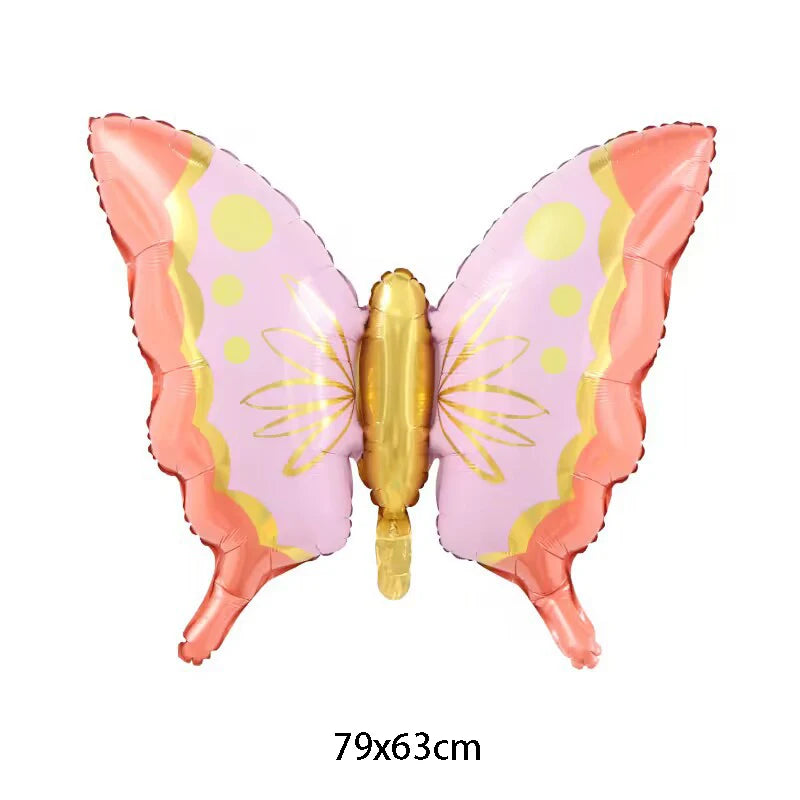 Butterfly-shaped balloon with pink and gold design on a white background