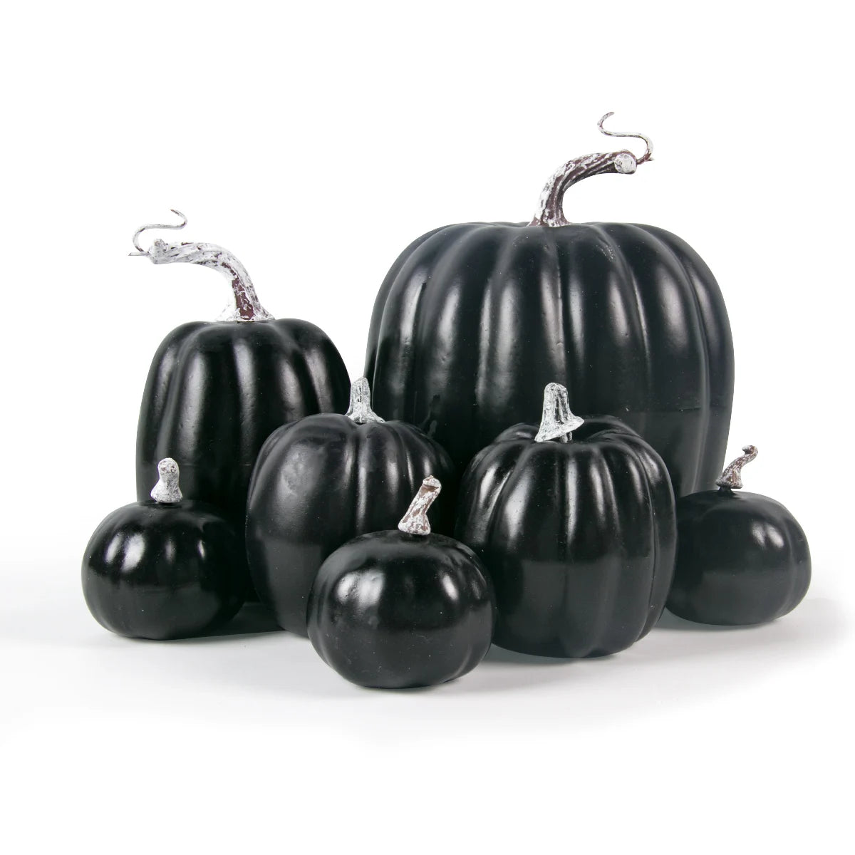 Set of black pumpkins on a white background
