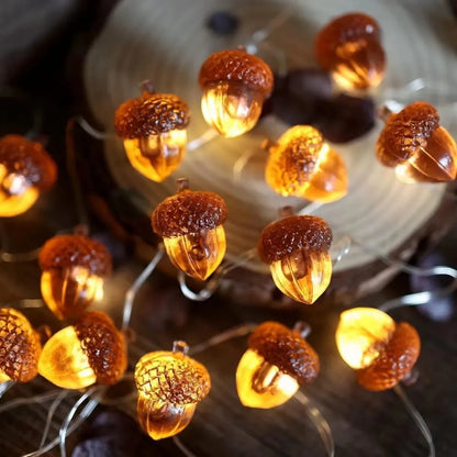 String lights shaped like acorns on a wooden surface